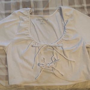 Cropped short sleeve two bow front top